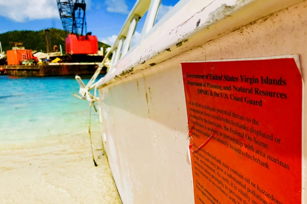 A red notice on a grounded vessel. 