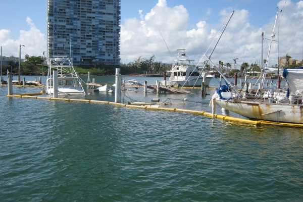Pollution boom surrounding vessels. 