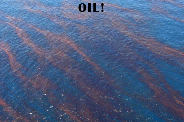 Streaks of an orange-red substance in water.